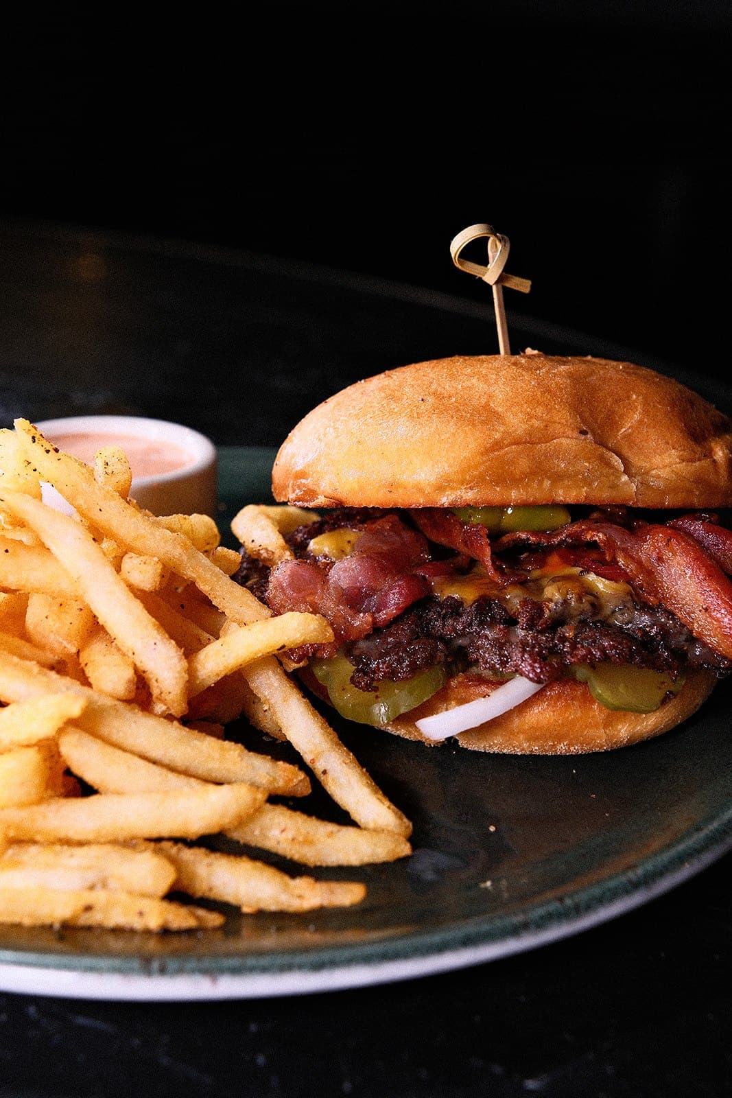 A burger and fries served at the bar