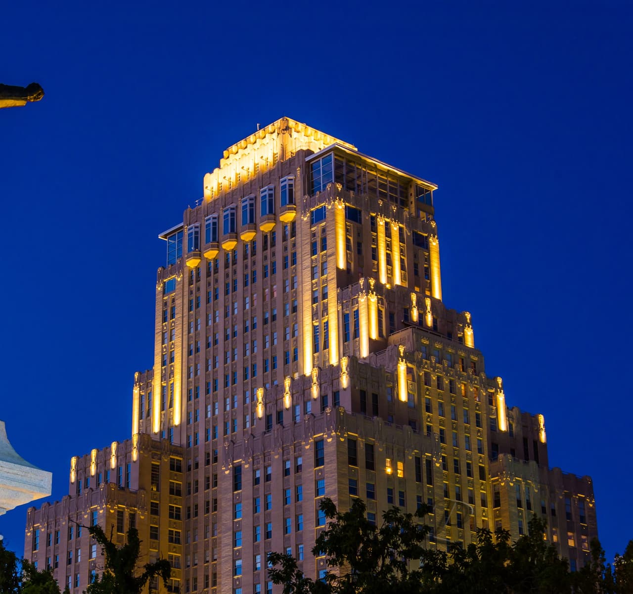 The Chase Park Plaza’s Art Deco tower lit gold against the night sky